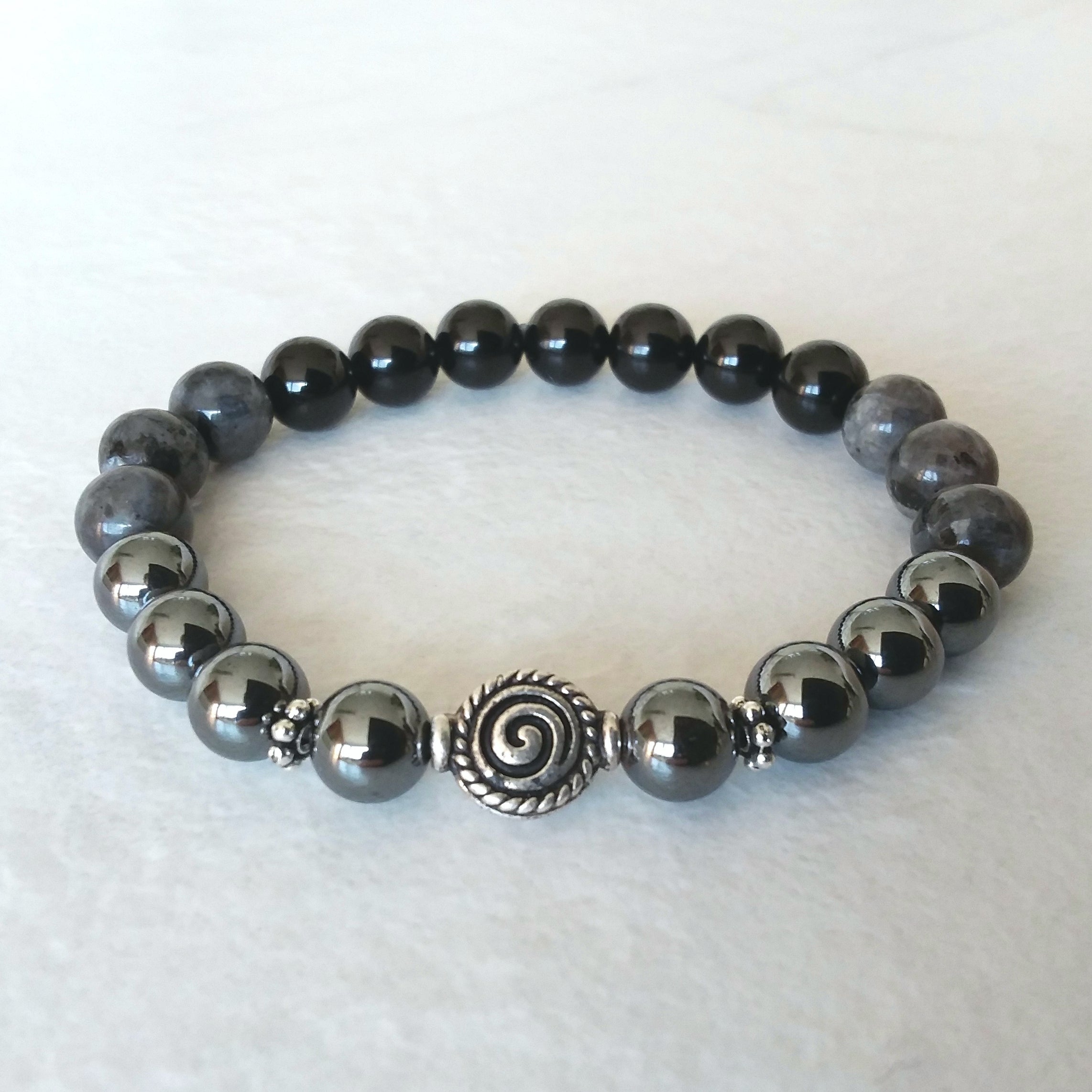 Larvikite and Hematite Stretch Bracelet with Spiral Symbol