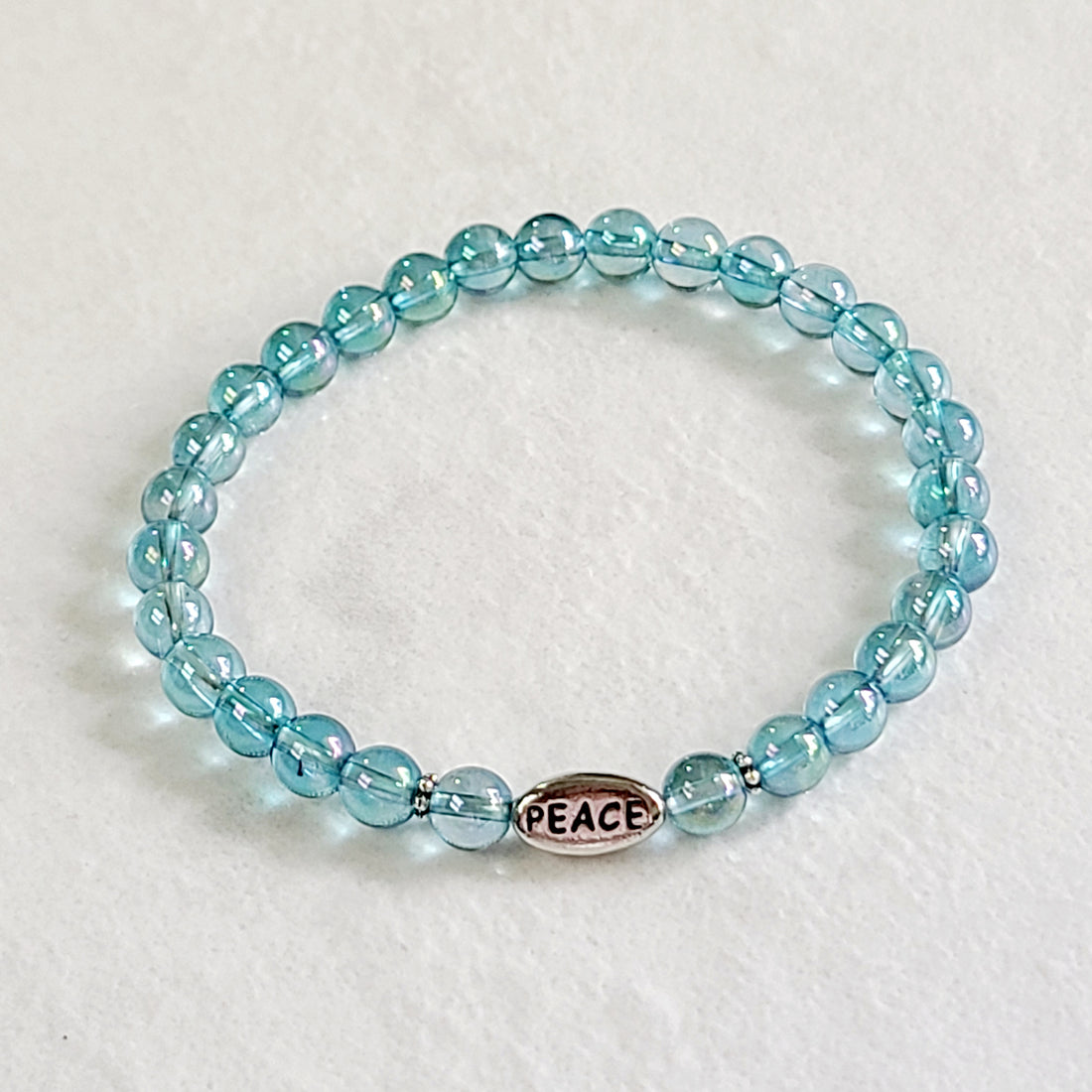 Aqua Aura Quartz Stretch Bracelet with “Peace”